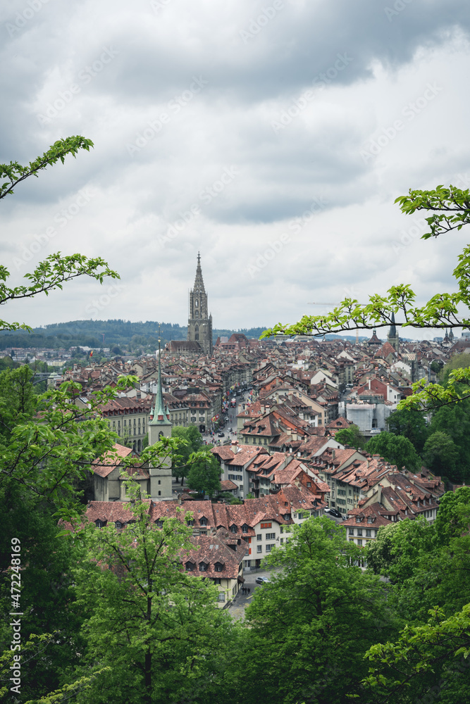 A view of Bern, Switzerland from the hill of Rosengarten (Rose Garden), with the red roofs of the city below - Aargauerstalden Viewpoint