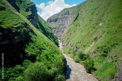 Beautiful landscape of mountains and river flowing into the gorge