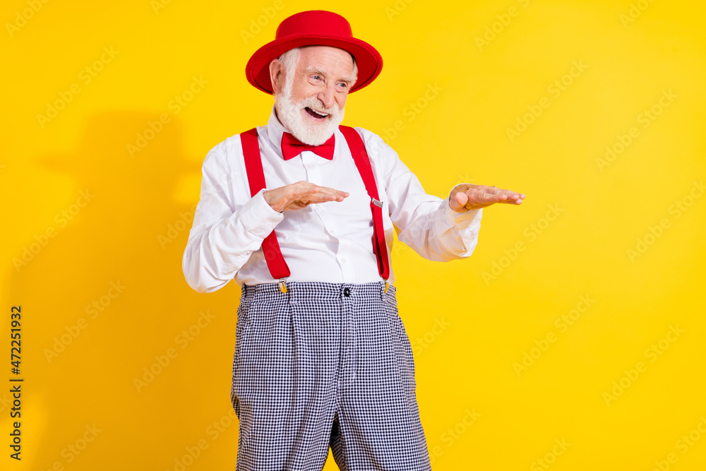 Photo of gentleman old man dance wear red cap tie shirt suspenders trouseres isolated on yellow background
