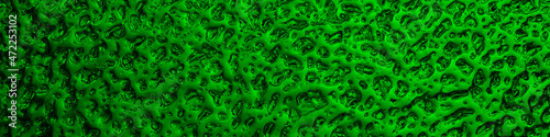 Bright green winter banner. The surface of ice frozen on the window glass. An abstract pattern with a metallic sheen, like streams of mercury. Rich vivid headline. Close-up