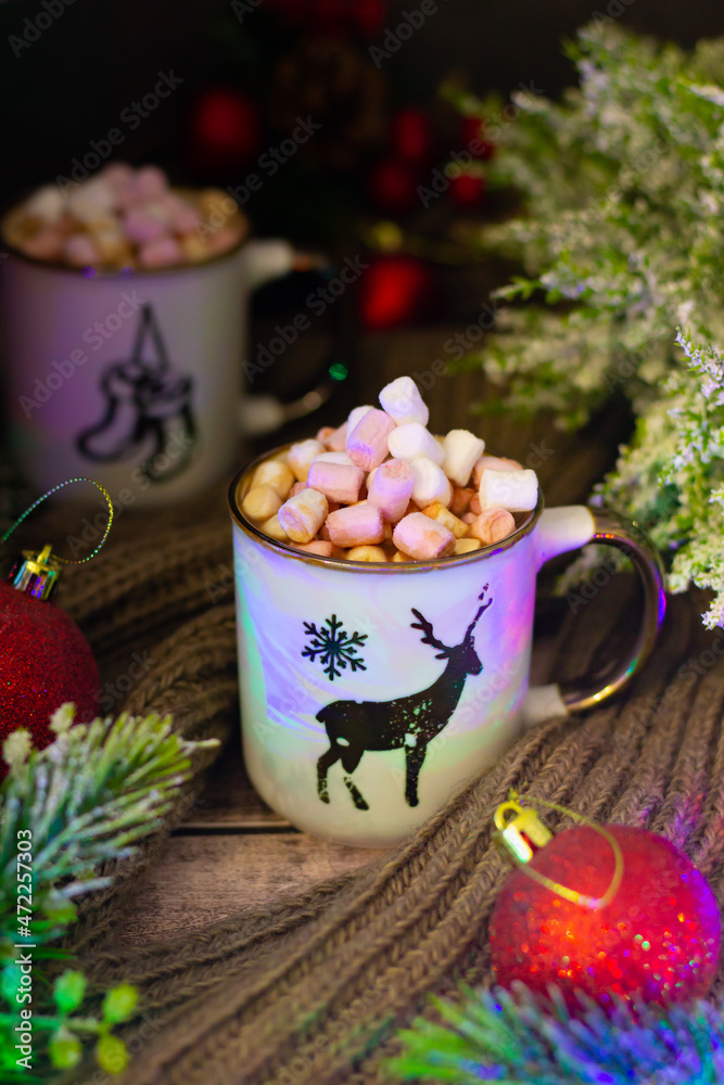 Warm mugs filled with creamy hot cocoa and marshmallows, adorned with festive deer and snowflake designs, nestled among holiday decor. Warm mugs filled with creamy hot cocoa and marshmallows, adorned with festive deer and snowflake designs, nestled among holiday decor.