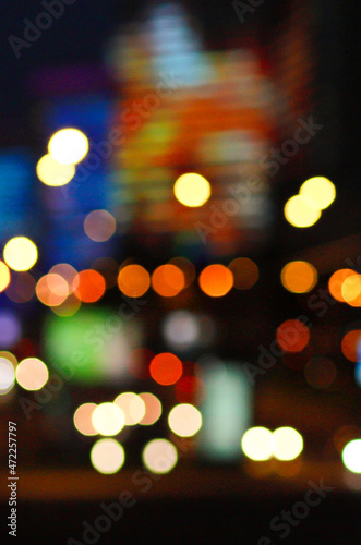 Blurred image of the night city and lanterns. Bokeh.