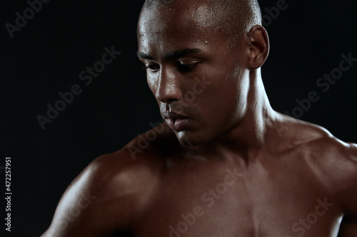 Cropped image of young tired athletic black man