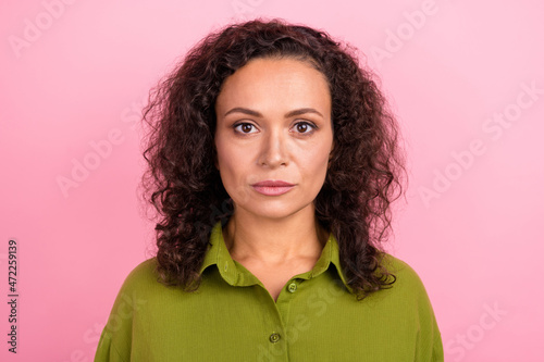 Photo of serious young afro american skin woman wear casual green shirt face isolated on pastel pink color background