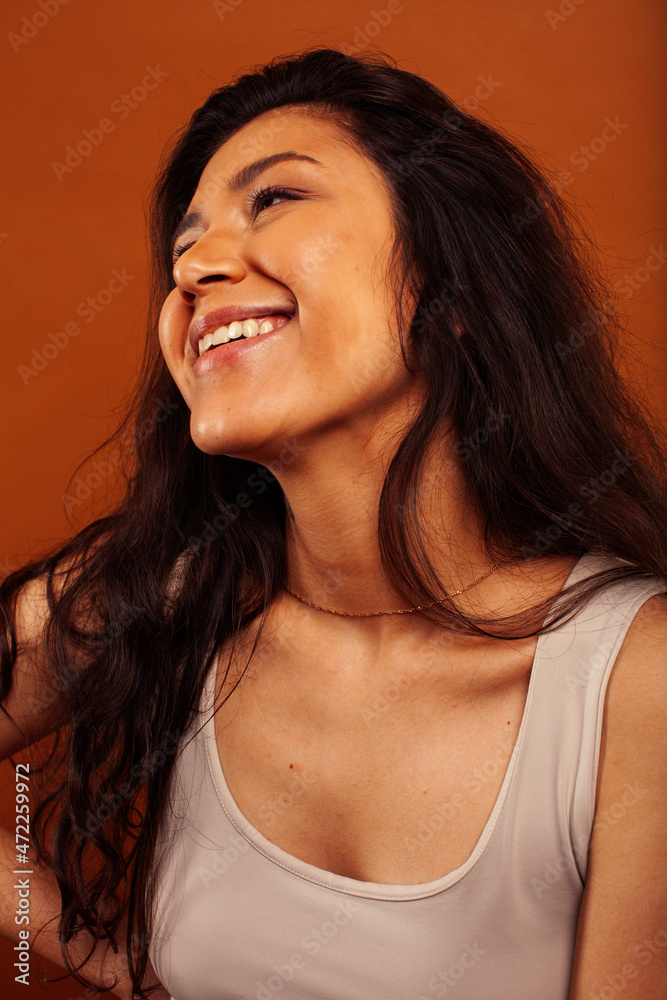 cute happy young indian woman posing cheerful on brown background in studio close up smiling, fashion beauty cute happy young indian woman posing cheerful on brown background in studio close up smiling, fashion beauty