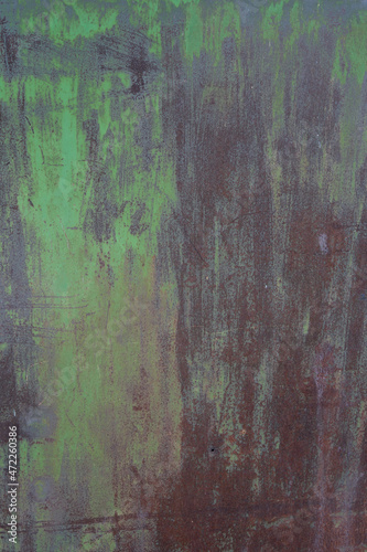 Texture of old metal. Metal background with paint residues. Corrosion of metal. Rust on a metal plate.