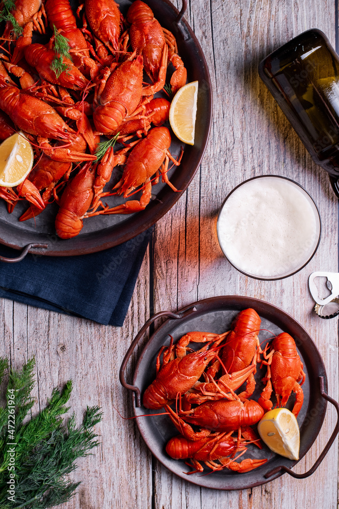 boiled crayfish with beer on a wooden background boiled crayfish with beer on a wooden background