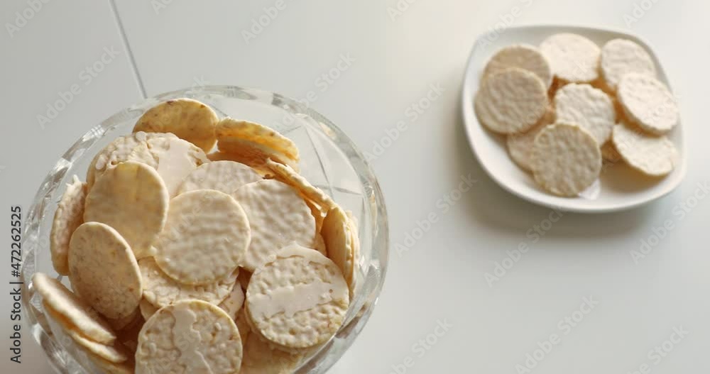 round cookies in white chocolate on a white table. sweet morning. crystal vase cookies round cookies in white chocolate on a white table. sweet morning. crystal vase cookies