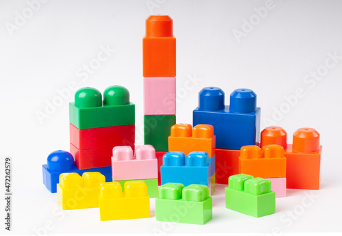 Various constructions resembling residential buildings made of colorful children's construction set.