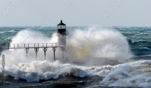 Gale force winds generated by winter storm Quiana crash into the St. Joseph, Michigan outer lighthouse on the Great Lakes