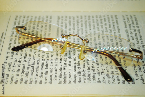 Glasses placed on an open book