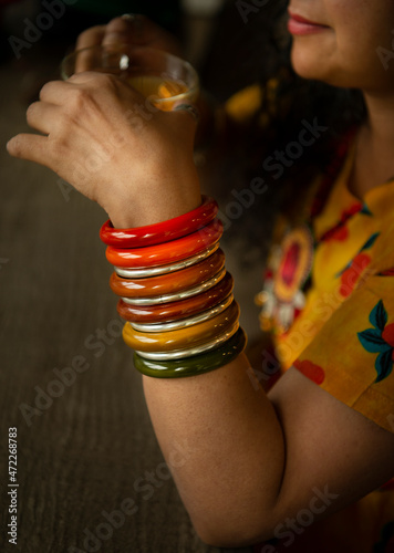 Woman with bagels drinking tea  photo