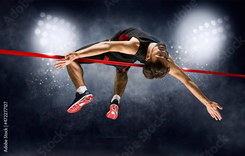 Man in action of high jump