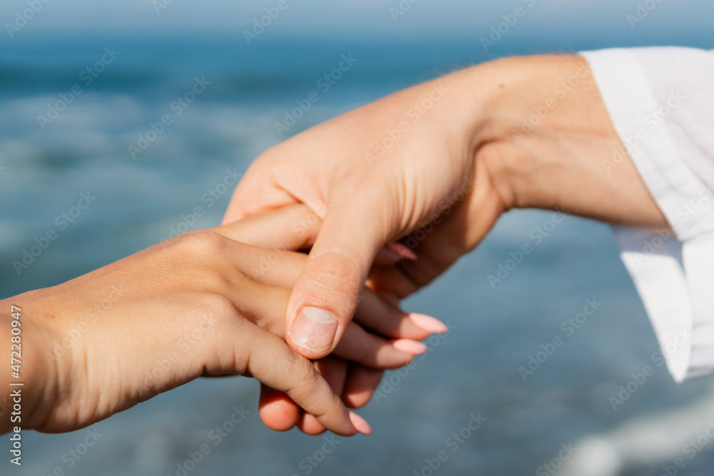 Close up holding hands a couple Close up holding hands a couple