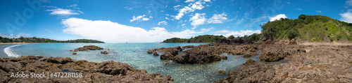 Fototapeta Naklejka Na Ścianę i Meble -  Panorama of stone seashore and blue sea New Zealand