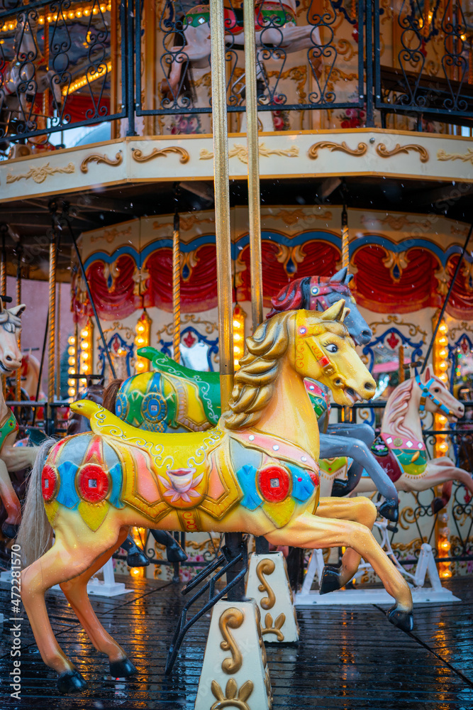 Wooden horse on the carousel. Retro attraction for children.