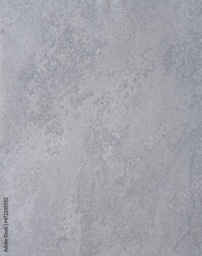 Gray irregular surface for background, possibly paper or plastic