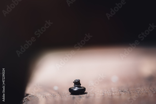 bolt head turned over to show sheared threading after stress failure