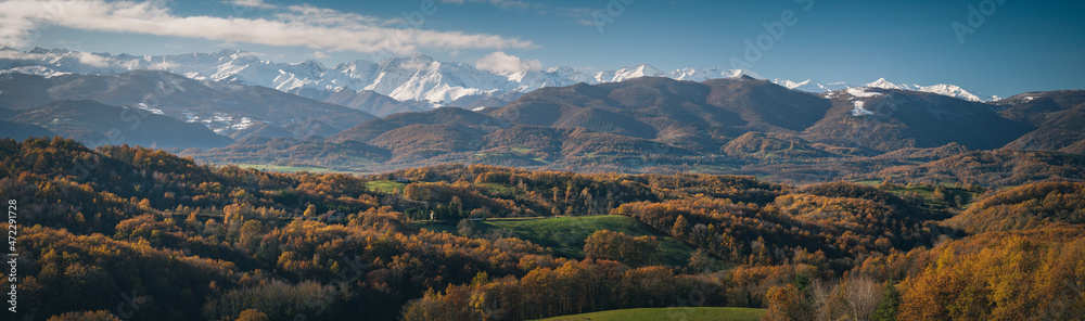 Landscape of southwestern France in autumn with the Pyrenees mountains in the background
