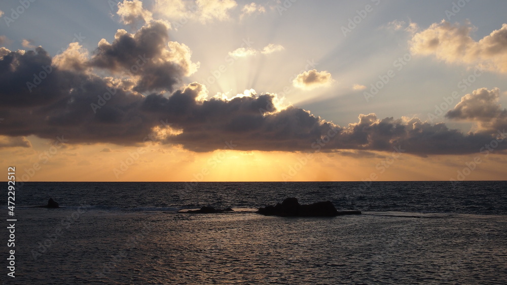 Colorful ocean beach sunrise with deep blue sky and sun rays. Beautiful sunset on a Beach
Beautiful cloudscape over the sea, sunrise shot