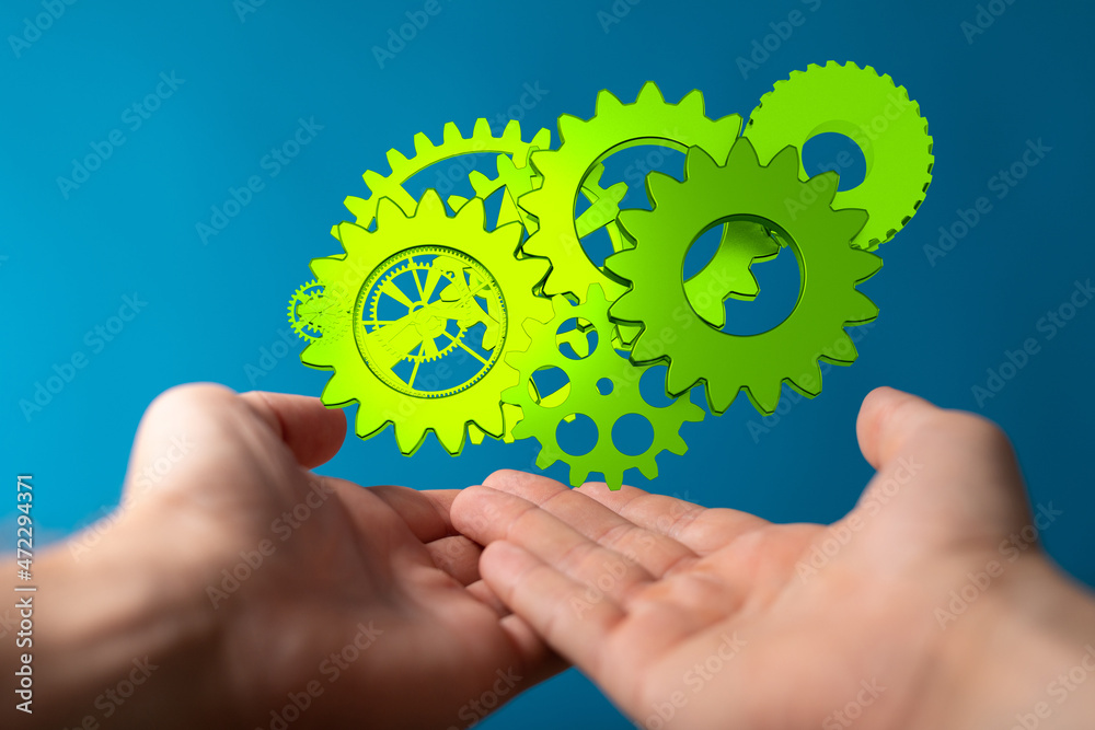 Set of green gears and cogs on black background Set of green gears and cogs on black background