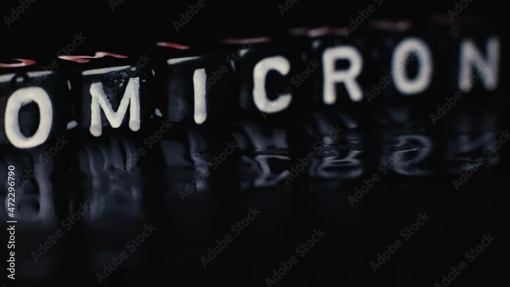 SARS-CoV-2 Coronavirus Variant Omicron. OMICRON name reveal. Red and black background. SARS-CoV-2 Coronavirus Variant Omicron. OMICRON name reveal. Red and black background.