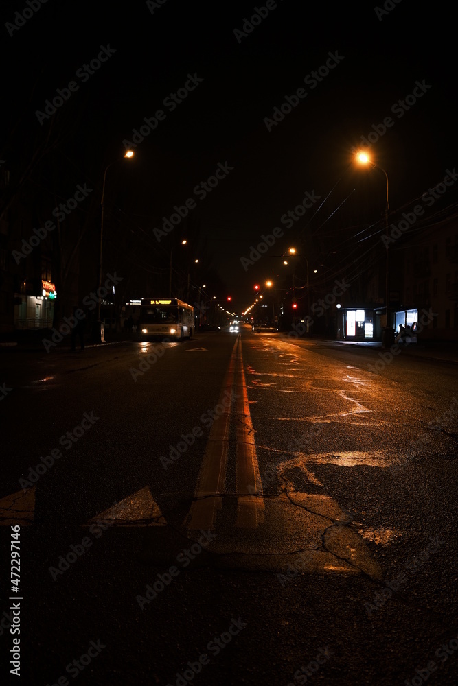 Fototapeta premium Night road with reflection from the lights