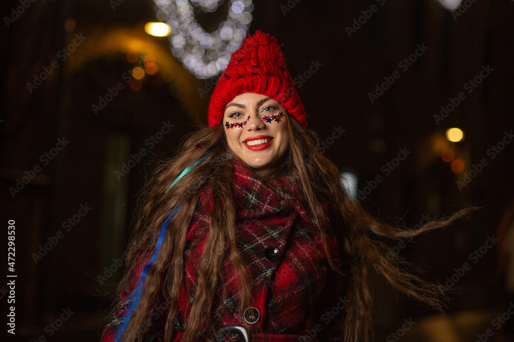 Expressive lady walking at the new year's eve at the city Expressive lady walking at the new year's eve at the city