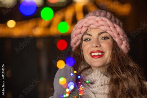 Happy lady posing with blurred lights