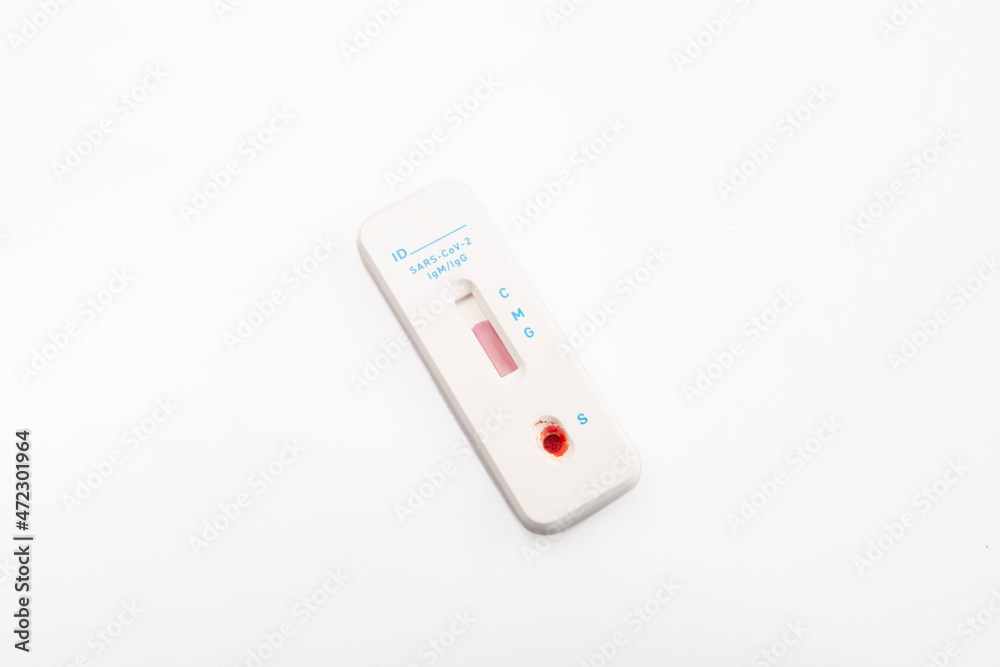 isolated shot of a rapid express antigen antibody coronavirus covid-19 pandemic test sample with blood on white background isolated shot of a rapid express antigen antibody coronavirus covid-19 pandemic test sample with blood on white background