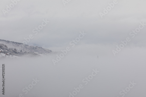 Winter in Croatia. Church. Fog. Snow