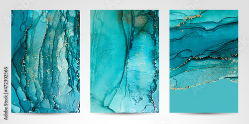 Marble Modern texture in blue color. Alcohol ink splash with isolated gold foil dots. Trendy poster design. Liquid flow art