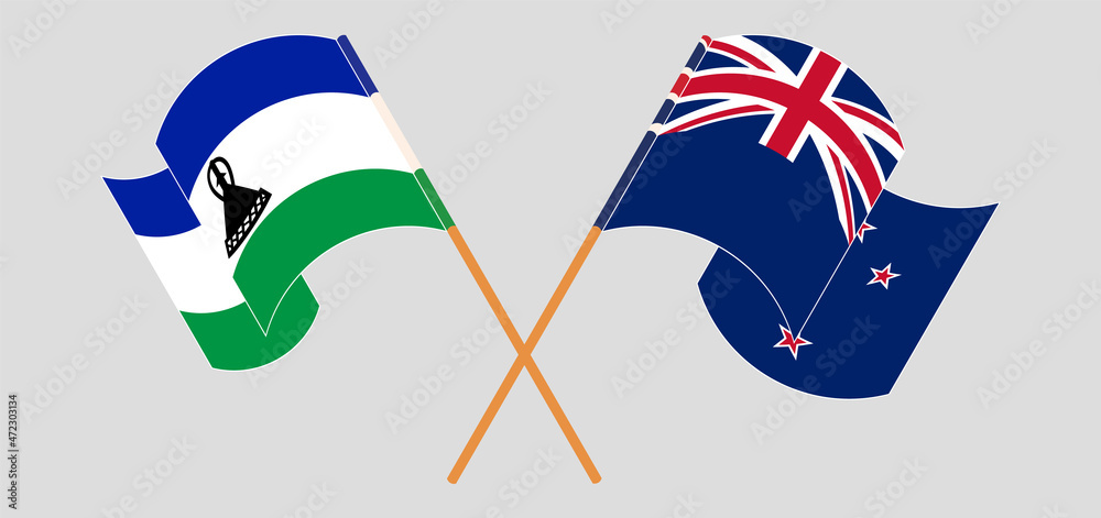 Crossed and waving flags of Kingdom of Lesotho and New Zealand