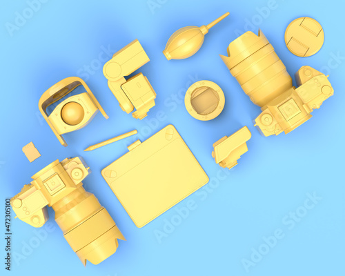 Top view of designer workspace and photography gear on blue table background photo