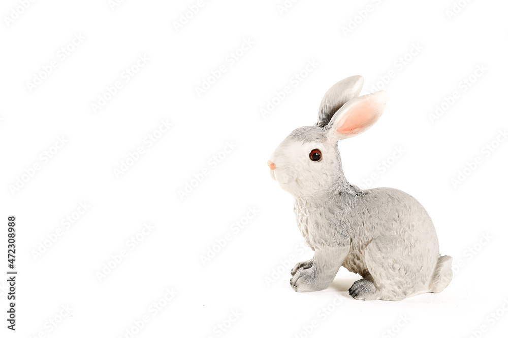 figurine of a hare on a white background. Easter minimalistic concept figurine of a hare on a white background. Easter minimalistic concept