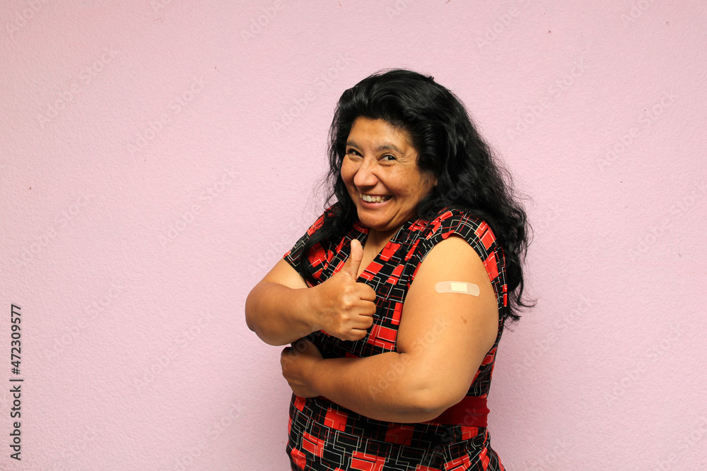 Body positive overweight adult laina woman shows her arm recently vaccinated against Covid-19 in the new normal for the Coronavirus pandemic
Body positive overweight adult laina woman shows her arm recently vaccinated against Covid-19 in the new normal for the Coronavirus pandemic