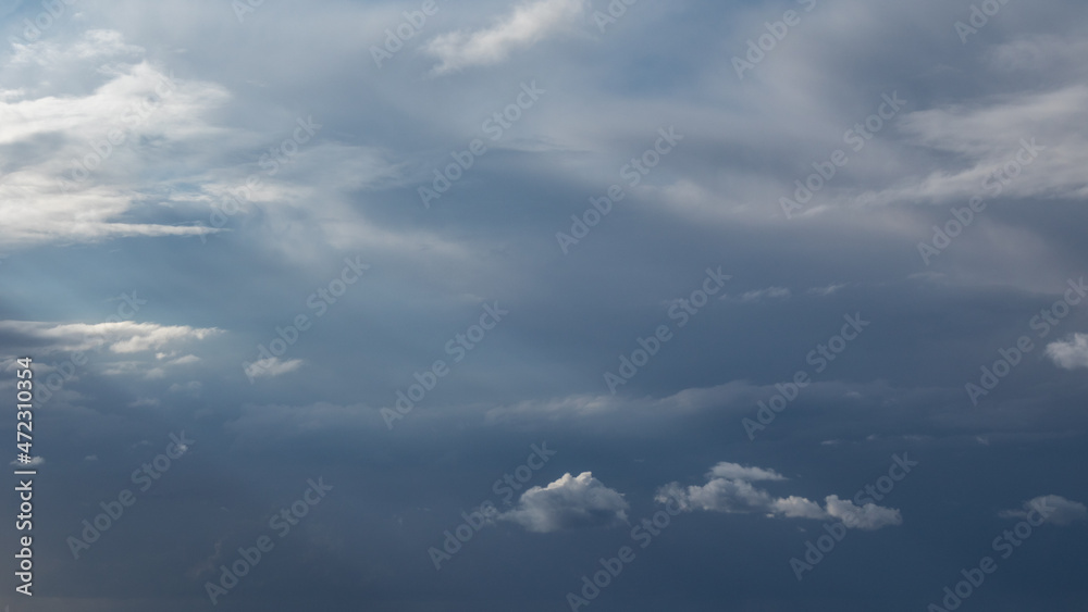 Dark stormy sky with heavy cloudscape background. Skyscape natural heavenly scenery in summertime above sea Dark stormy sky with heavy cloudscape background. Skyscape natural heavenly scenery in summertime above sea