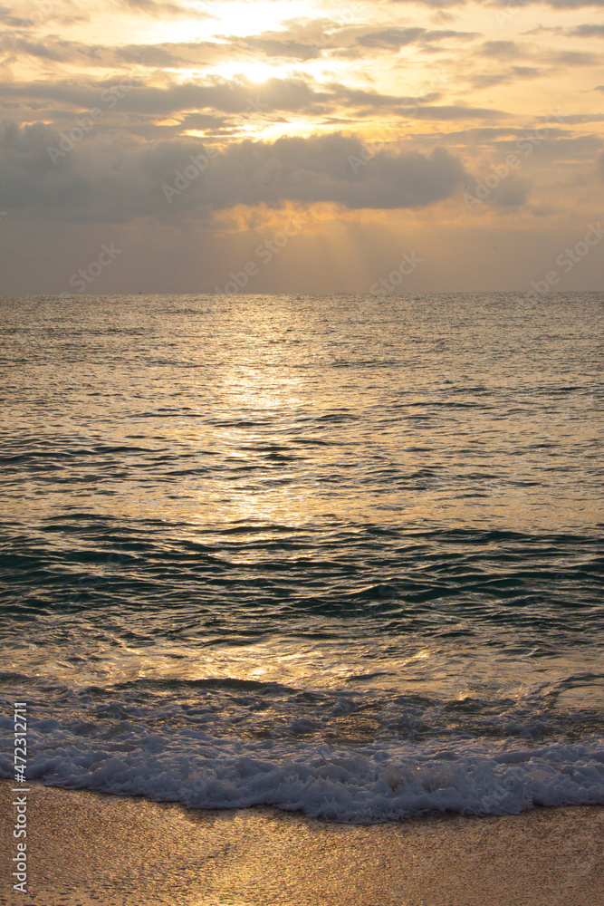 Thailand, Ko Samui. Light surf hitting the beach the beach at sunset.