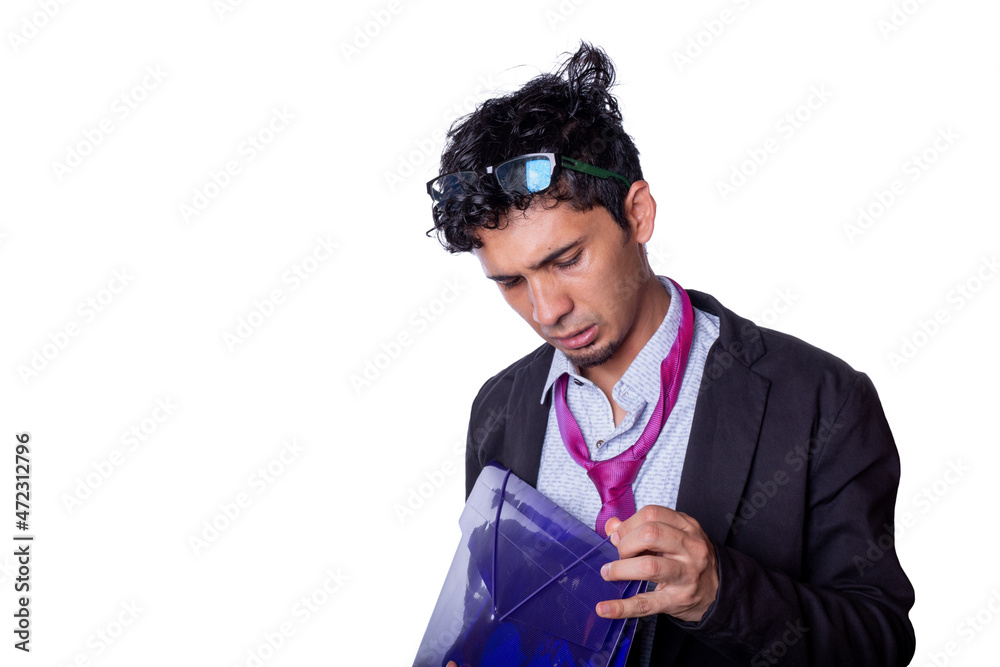 worried businessman trying to open a folder. Young adult with stressed and tired expression, isolated on all-white background. worried businessman trying to open a folder. Young adult with stressed and tired expression, isolated on all-white background.