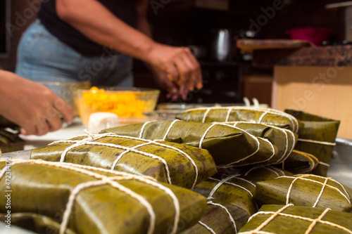 Traditional Venezuelan cuisine for the December festivities, Hallacas are a typical dish that is prepared as a family and represents ancestral traditions of a mixture of ingredients wrapped in leaves photo