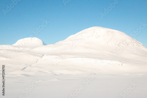 White mountains covered in snow along Kungsleden trail in April, between Salka and Singi, Swedish Lapland photo