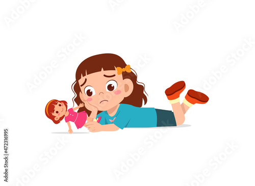 cute girl play toy doll alone and feel sad