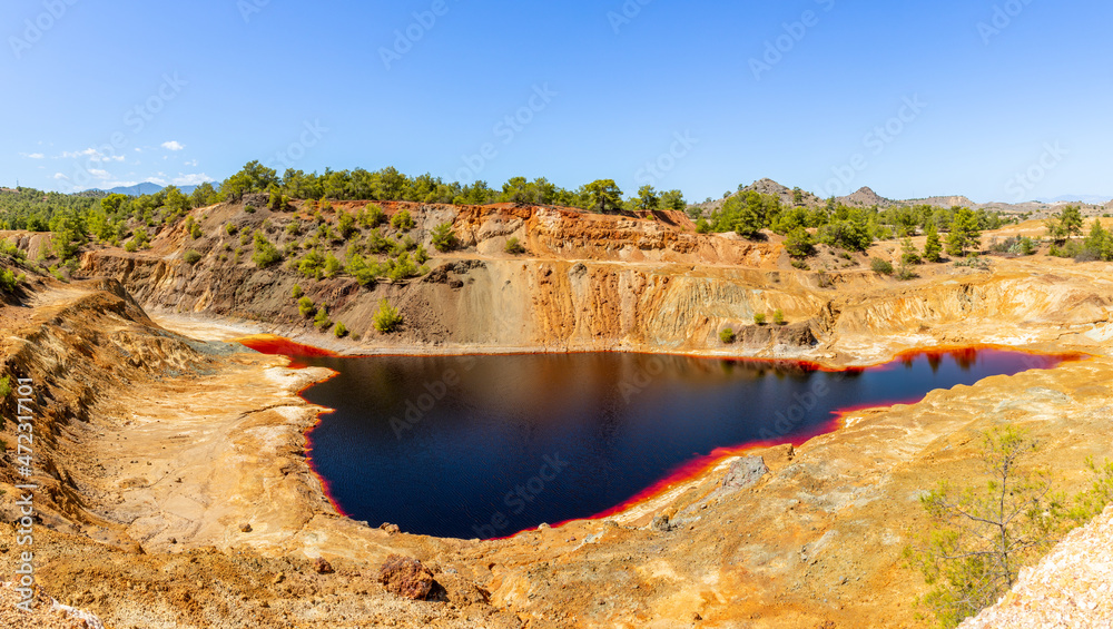 Red colored hazardous polluted Sha quarry lake, Nicosia, Cyprus