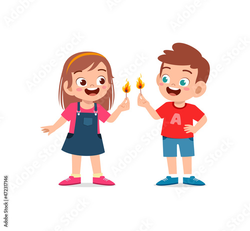 cute little boy and girl holding match stick with fire