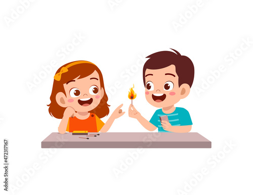 cute little boy and girl holding match stick with fire