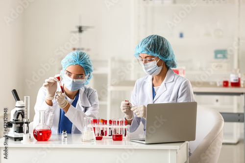 Scientists working with sam...