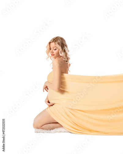 Young pregnant woman in lig...