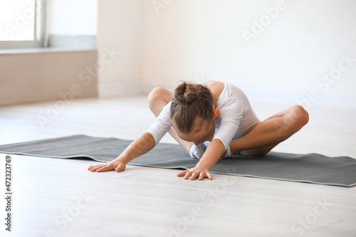 Little girl doing gymnastic...