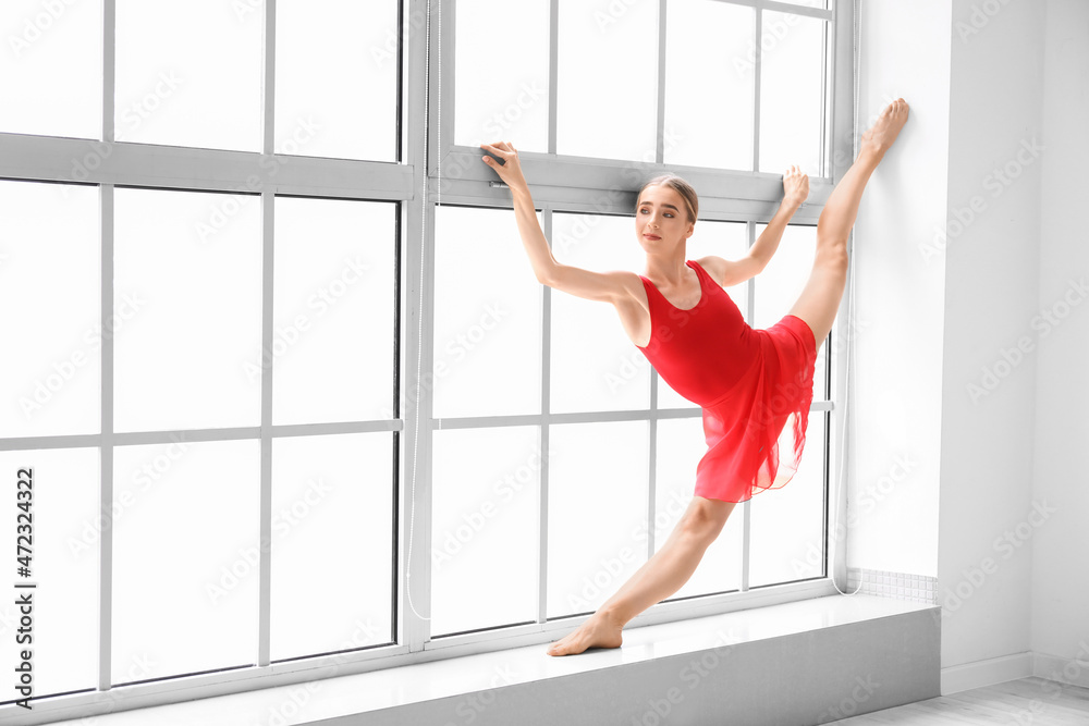 Beautiful young woman doing gymnastics in gym Beautiful young woman doing gymnastics in gym