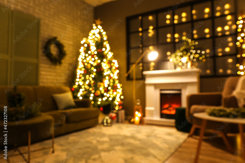 Blurred view of beautiful room with Christmas decor in evening Blurred view of beautiful room with Christmas decor in evening